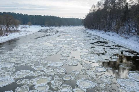 Close up of broken ice in flowing river Stock Photos