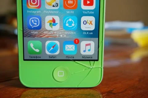 A close up of a broken phone screen on the table Stock Photos
