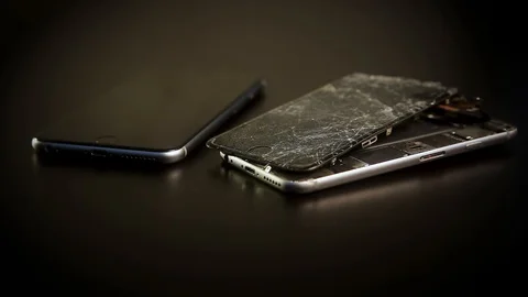 Close up broken smartphone rotation on black background Stock Footage 98636626