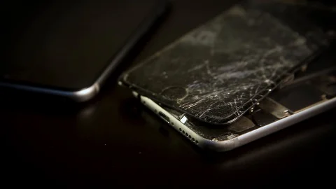 Close up broken smartphone rotation on black background Stock Footage 98636628