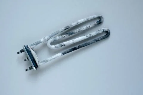 Close up broken ten. heating element of the washing machine Stock Photos