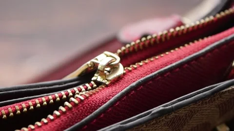 Close up of a broken zipper on a bag Stockbeeldmateriaal 340863472