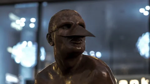 Close up Of Bronze Sculpture Of Equilibrista 90 Monumental At Night In Stock Footage 150699363