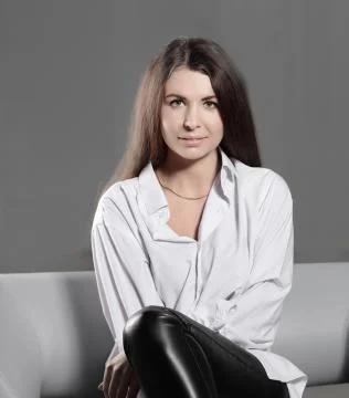Close up. a brooding creative woman sitting on an office chair .photo with copy Stock Photos