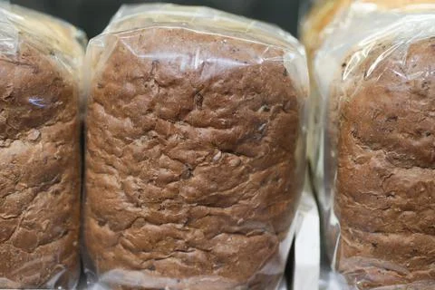 Close up of brown bread in a plastic packet Stock Photos