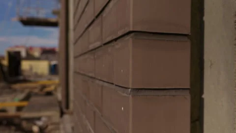 Close up of brown brick facade corner on building under construction Stock Footage 347514788