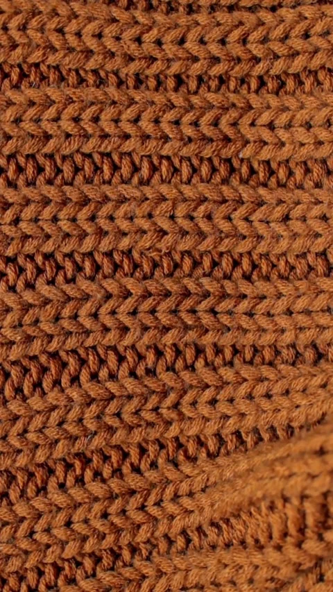 Close-up of brown chunky knit wool fabric. Stock Footage 303963230