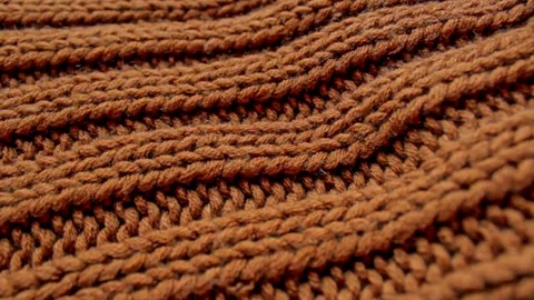 Close-up of brown chunky knit wool fabric. Stock Footage 303963233