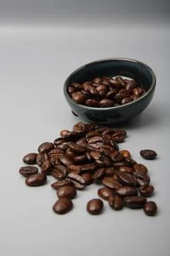 Close-up of brown coffee beans in a bowl, coffee beans background, coffee b.. Stock Photos