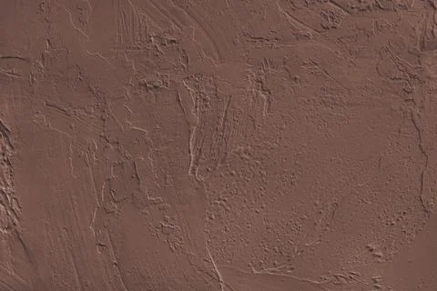 Close up brown colored painted plaster wall surface background with rough b.. Foto stock