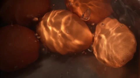 Close-up of brown eggs boiling in bubbling hot water Stock Footage 312767284
