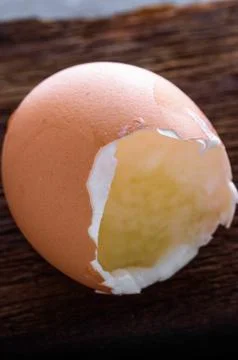 Close-up of Brown Empty Eggshell on Wooden Surface in 4K Image Stock Photos