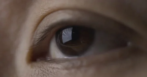 Close-up brown eye is opening and watching laptop. Stock Footage 141908161