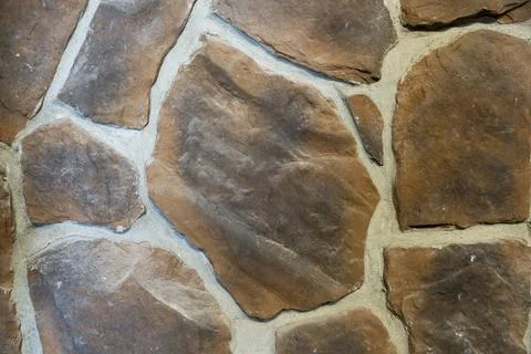 Close-Up of Brown Fieldstone Wall Texture with Natural Stone Masonry Stock Photos