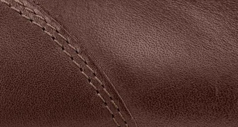 Close-up of brown genuine leather texture with double stitching Stock Photos
