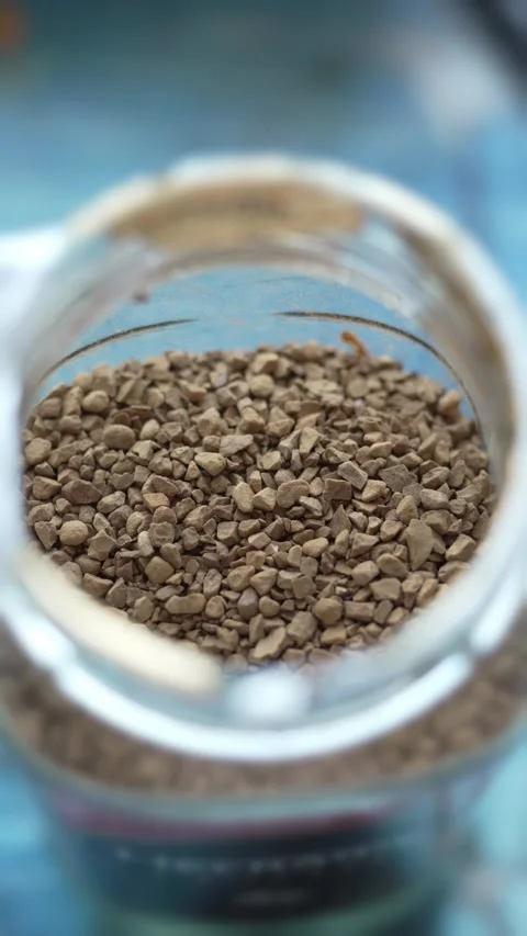 Close-up of brown instant coffee granules inside a glass jar Stock Footage 333633729