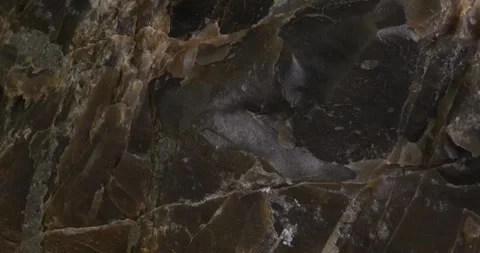 Close-up of Brown Layered Rock Surface with Textured Patterns Stock Footage 291942139