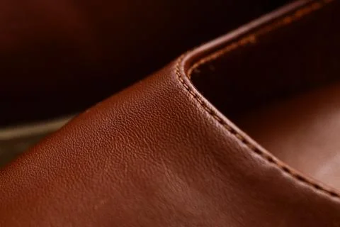 Close up of brown leather texture with visible stitching, material quality an 库存照片