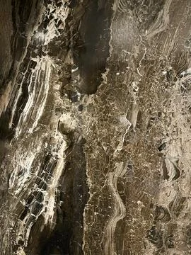 Close-up of brown marble surface with polished texture and natural patterns Stock Photos