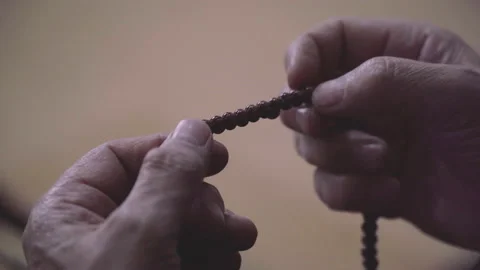 Close up brown prayer beads, Hand Of Muslim People Praying Stock Footage 238915349