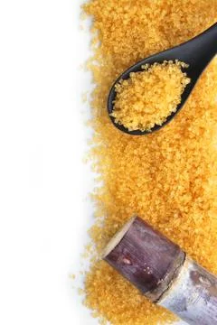 Close up brown sugar and sugarcane Stock Photos