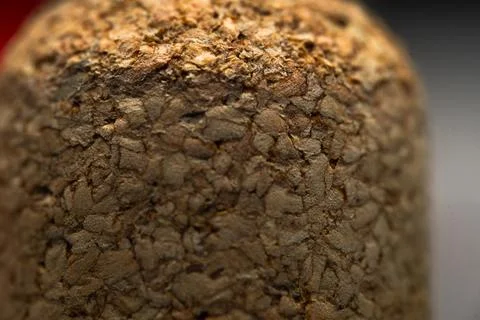 A close up of a brown surface with a grainy texture. The surface appears to.. Stock-Fotos