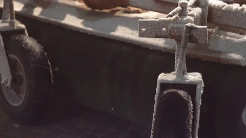 Close up brush and wheels of a moving snowplow Stock Footage 124334196