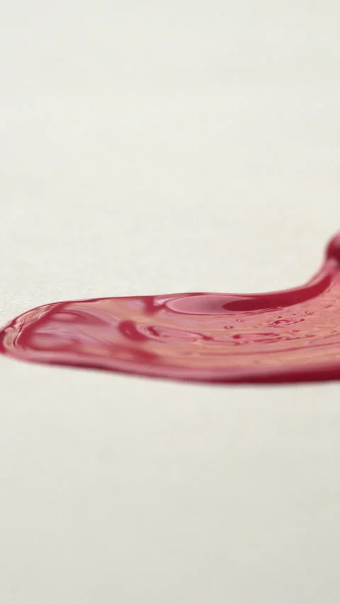 Close-up of brush bristles on paper drawing a red line with paint, oil or g.. Stock Footage 336973585