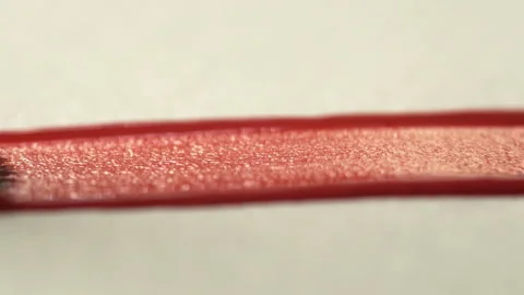 A close-up of a brush leaving a red line on white paper. The process of bru.. Stock Footage 338340101