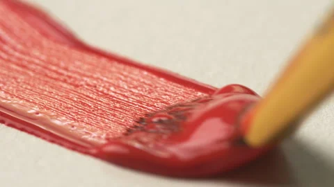 A close-up of a brush leaving a red line on white paper. The process of bru.. Stock Footage 338340135