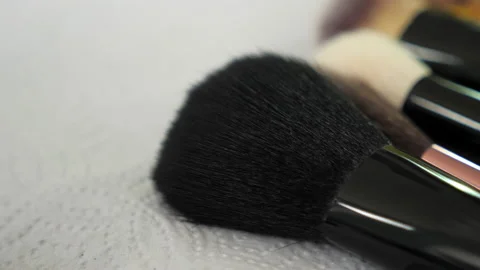 Close up brush lies on the table of a makeup artist in a beauty salon Stock Footage 132971828