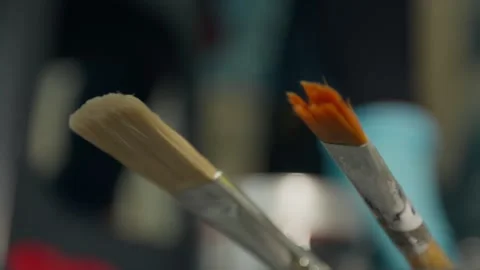 Close up of brushes and restorer's hand Stock Footage 267849798