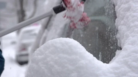 Close-Up Of Brushing The Snow Off The Snow Covered Car Stock Footage 45391616