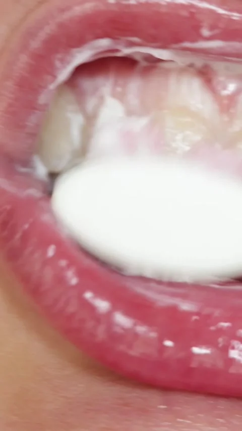 Close-up of brushing teeth with foam and toothbrush, oral hygiene routine Stock-Footage 343838144