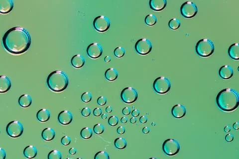 Close up of bubble drops on green background Stock Photos