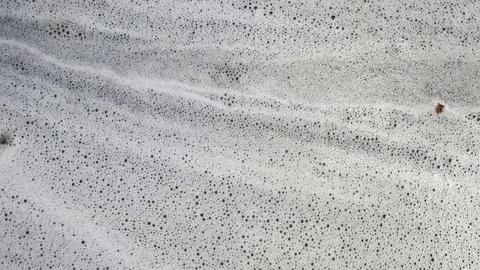 Close - up of bubble flowing after car wash. Video stock 72845051