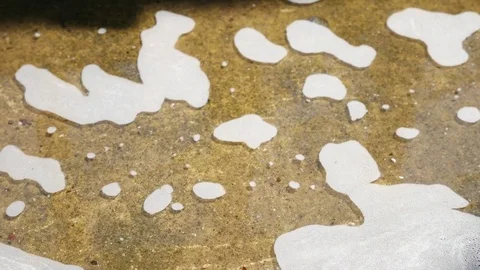Close - up of bubble flowing after car wash. Video stock 72845053