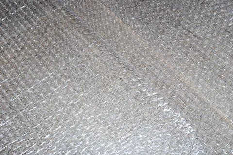 A close-up of bubble wrap, highlighting its texture and protective properties Stock Photos