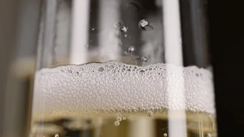 Close-up of bubbles and foam of sparkling champagne Stock Footage 261279155