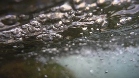 Close up of bubbles in clear mountain spring water beautiful nature texture Stock Footage 156047493