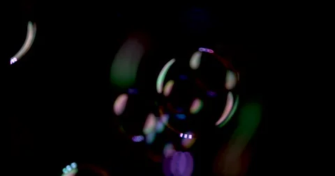 Close up of Bubbles Floating Around Against a Black Background Stock Footage 270401118