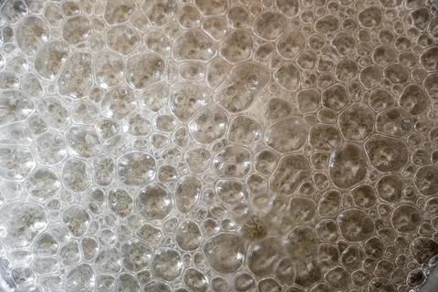 Close up of bubbles forming during melting and caramelizing sugar Stock Photos