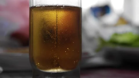 Close-up of bubbles in a glass with fresh cool beer. Stock Footage 197046154
