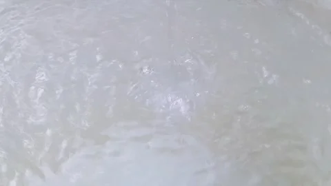 Close Up Of Bubbles Rising In Light Blue Water Clip Video stock 332104720