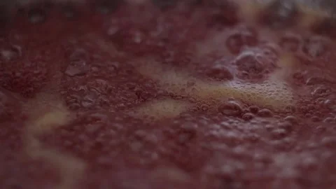 Close-up Bubbles of Strawberry Jam (50 fps) Stockbeeldmateriaal 233471346