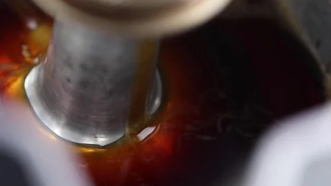 Close-up of bubbling and crema espresso coffee in a moka pot. Selective focus. Stock Footage 245630836