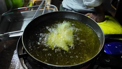 Close Up Bubbling Oil Deep Frying Street Food in Pan Thai Night Market Stock Footage 330928475
