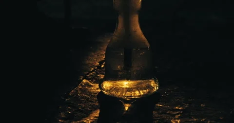 Close up of bubbling shisha hookah base at night Видео 343740950