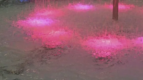 Close-up of bubbling water in a fountain with a backlight. Stockbeeldmateriaal 259812042