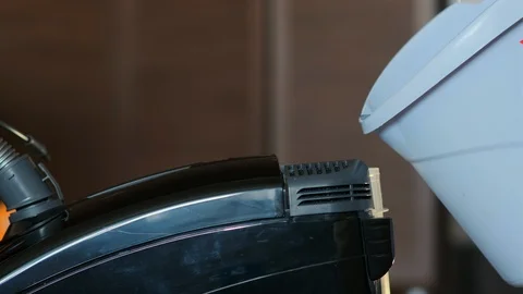 Close-up from bucket pour solution into washing vacuum cleaner Видео 122076681